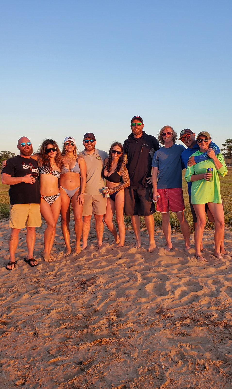 Group of friends on the beach at golden hour