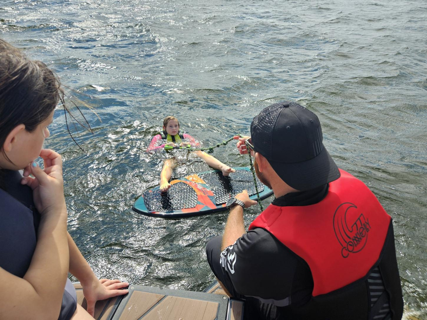 Kids learning to kneeboard with a captain